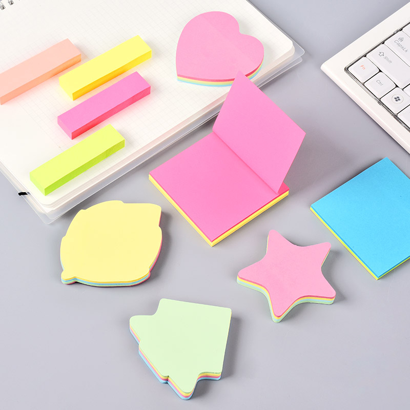 Die-cut sticky notes and memo pads used for daily task management